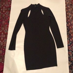 Black form fitted dress with slits on top.  Size S